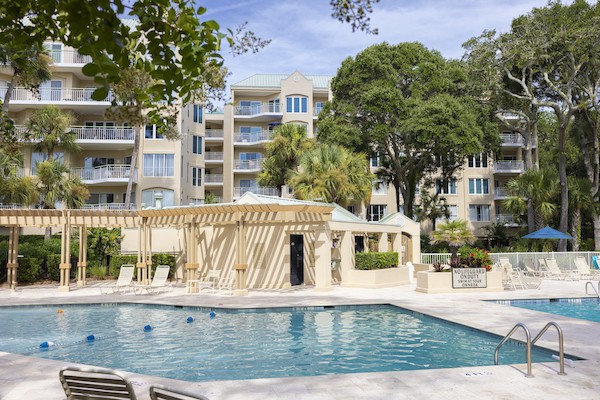 resort pool with bathrooms and pergolas at Windsor Place