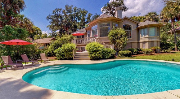 Stucco vacation rental home with pool