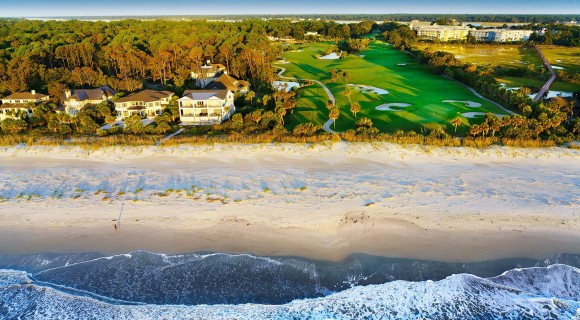 Bird's eye view of beach, vacation rentals and golf course